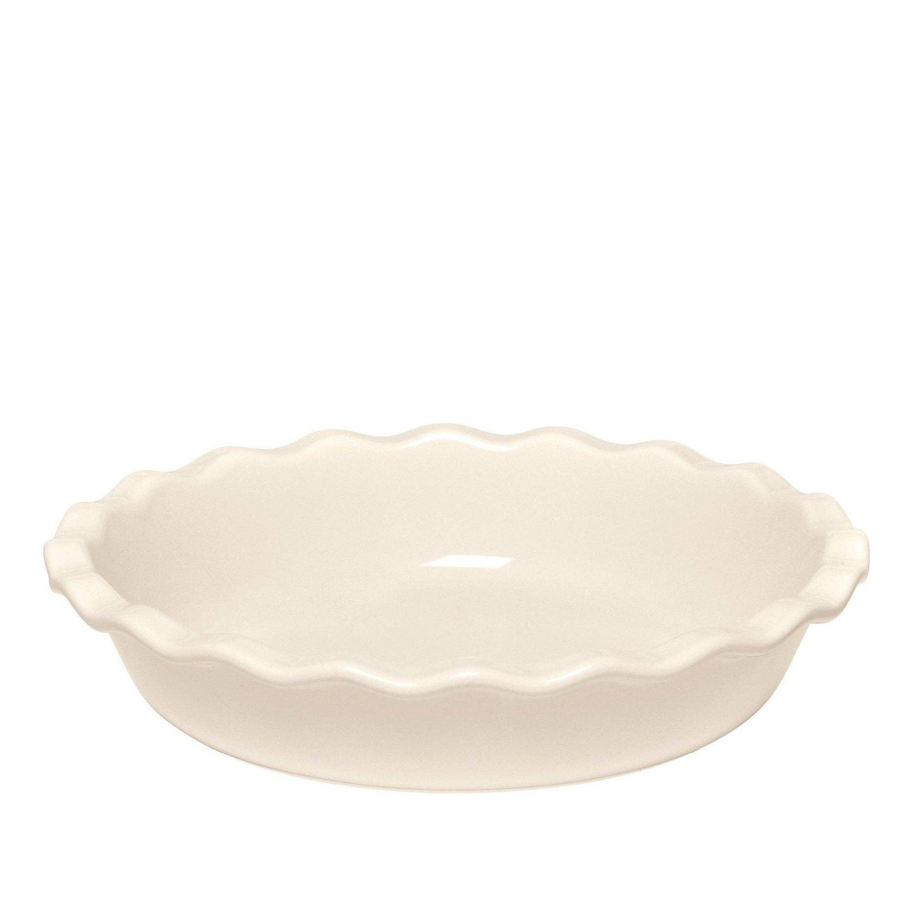 White ceramic pie dish with scalloped edge on a white background