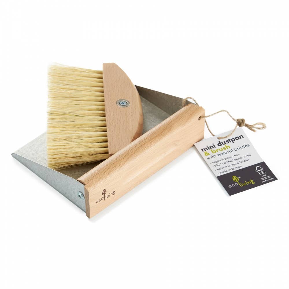 Dustpan and brush set with a tag on a white background