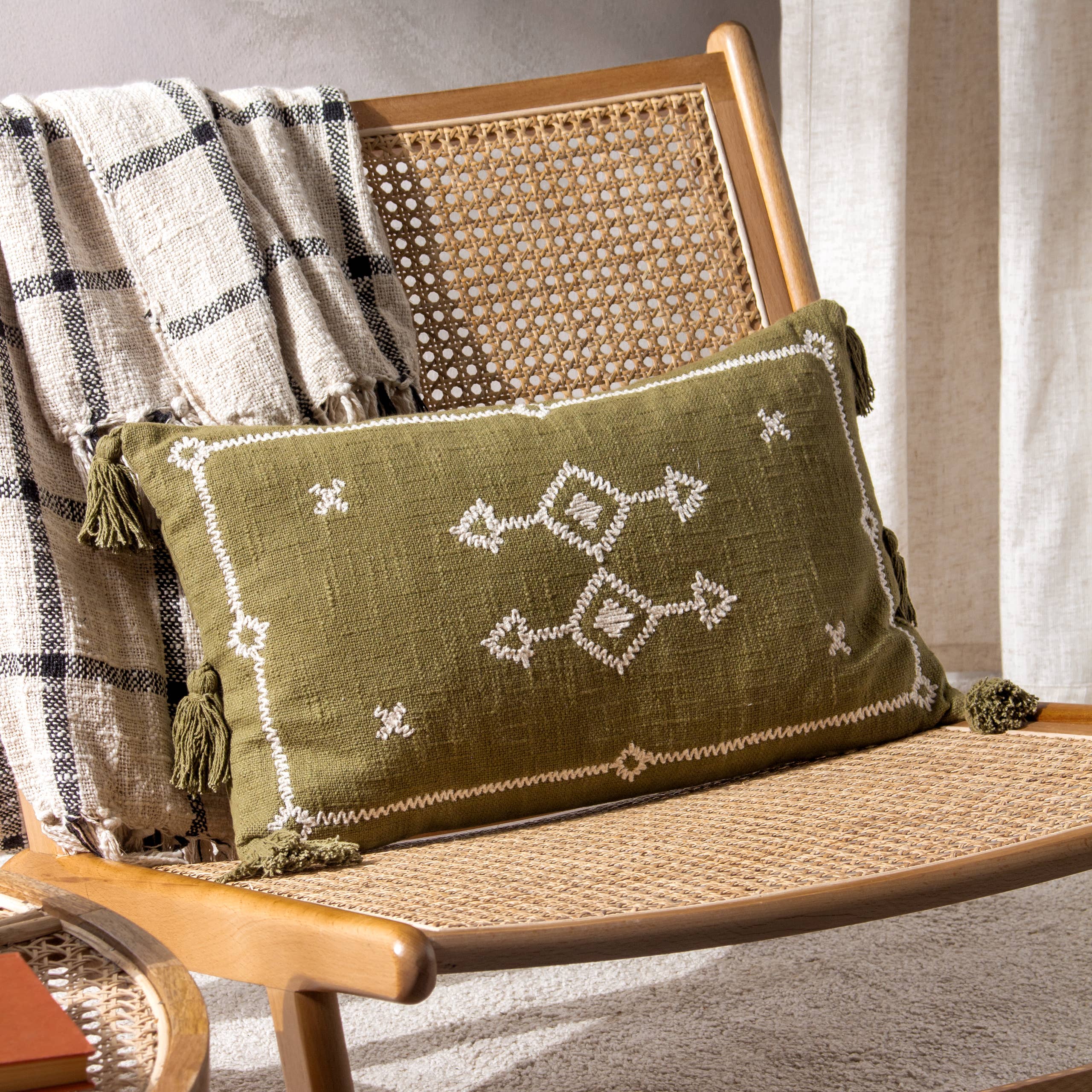 pattern moss green cushion on rattan chair