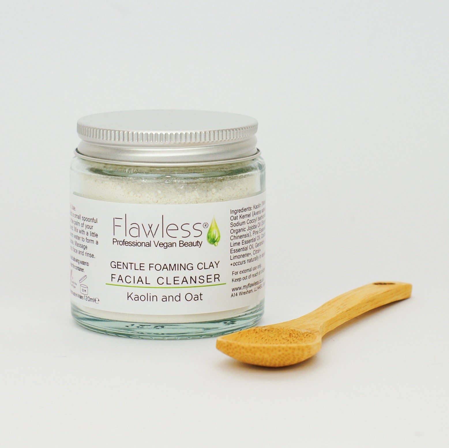 Jar of Flawless Gentle Foaming Clay Facial Cleanser with a wooden spoon on a white background