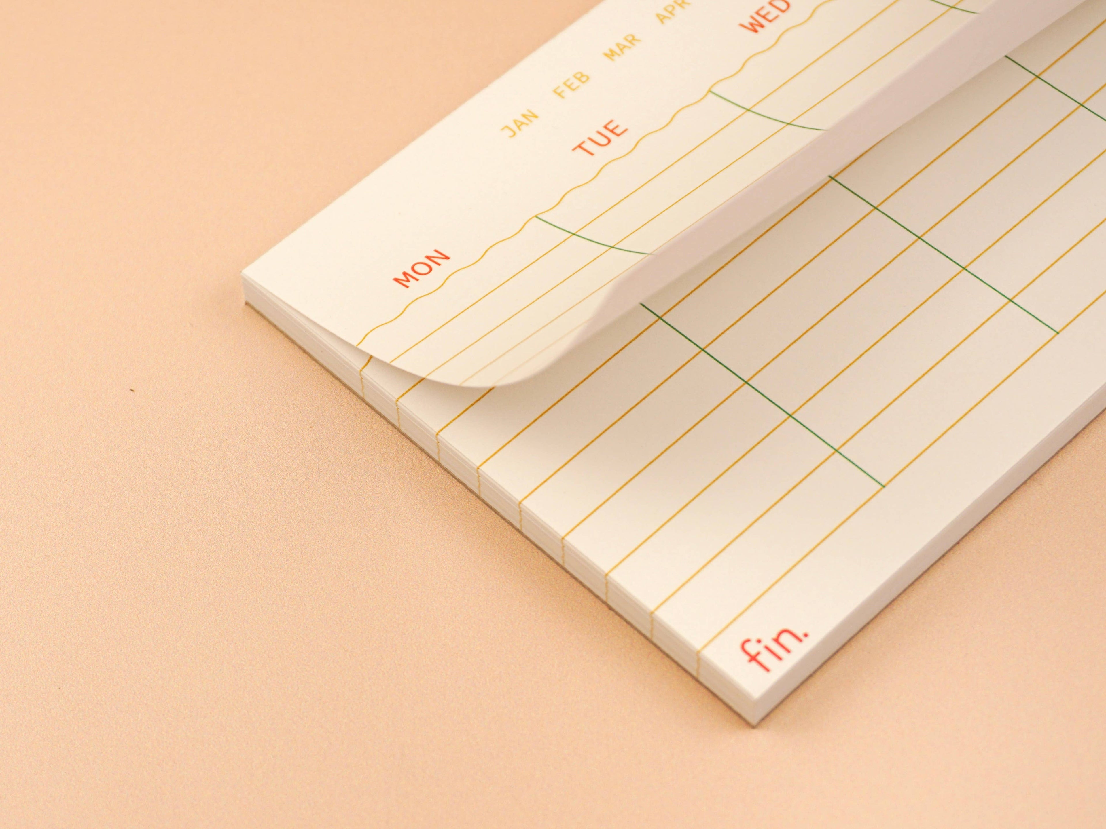 Weekly planner with days of the week on a beige background