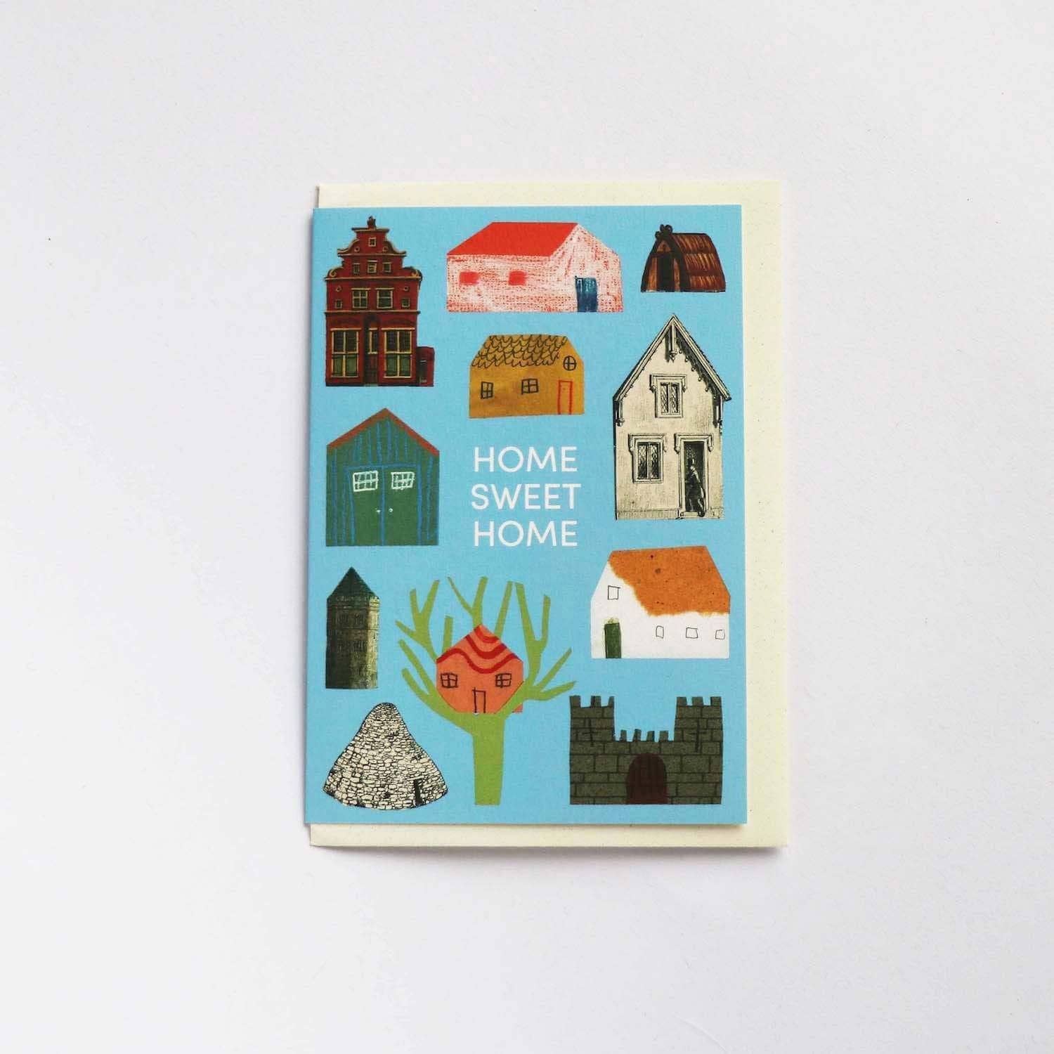 Notecard with illustrations of houses on a blue background