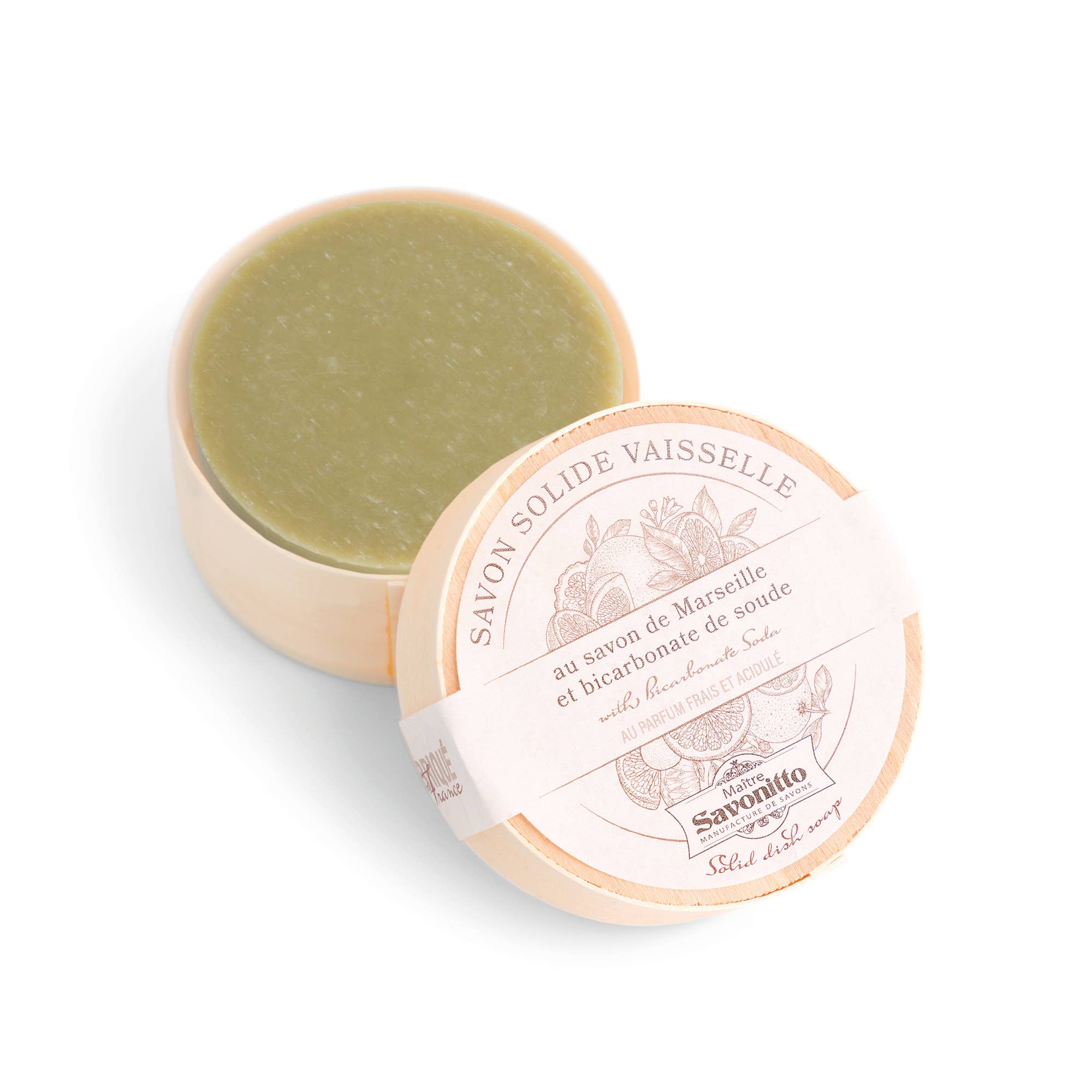 Solid Marseille soap in a round container with a white lid on a light beige background