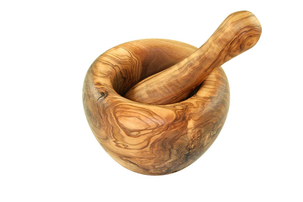 Wooden mortar and pestle on a white background