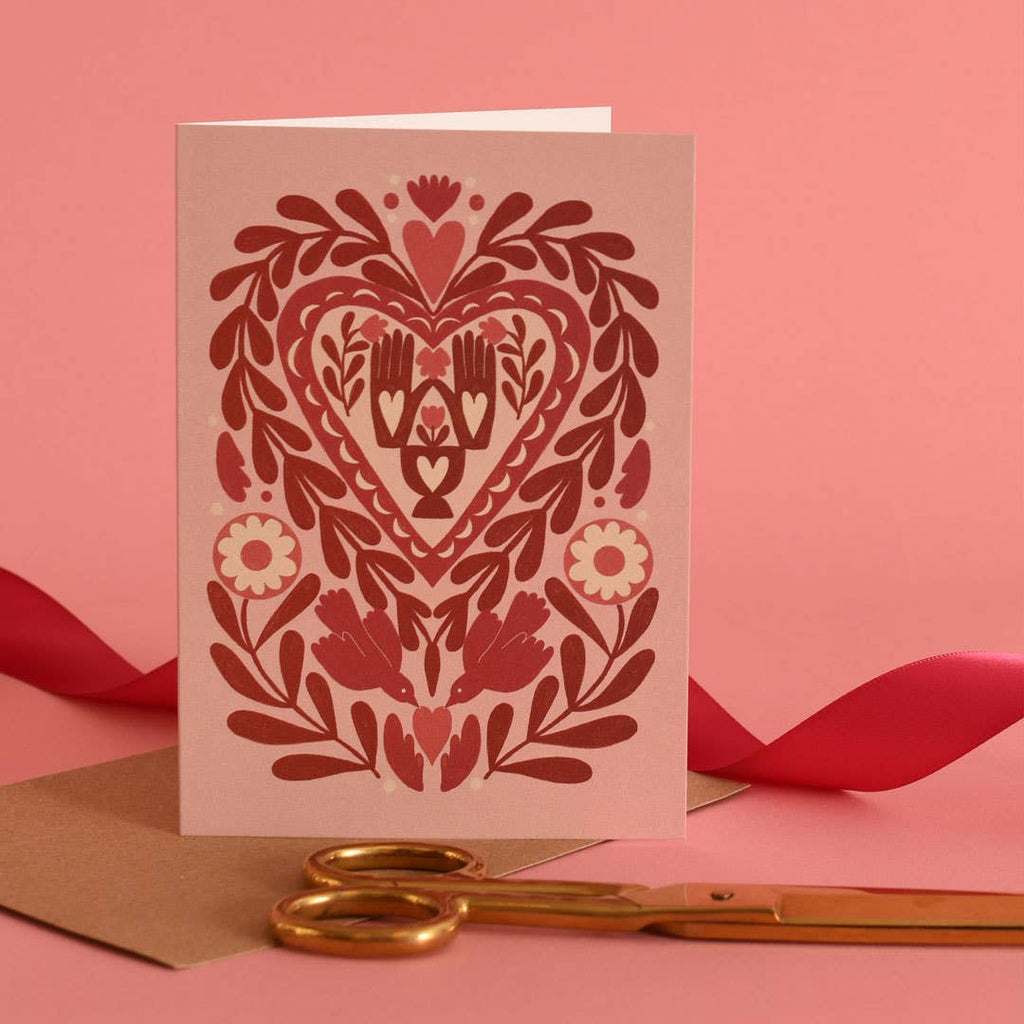 valentine card with folk art including hands and brids motifs