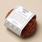 Copper pad with packaging on a beige background