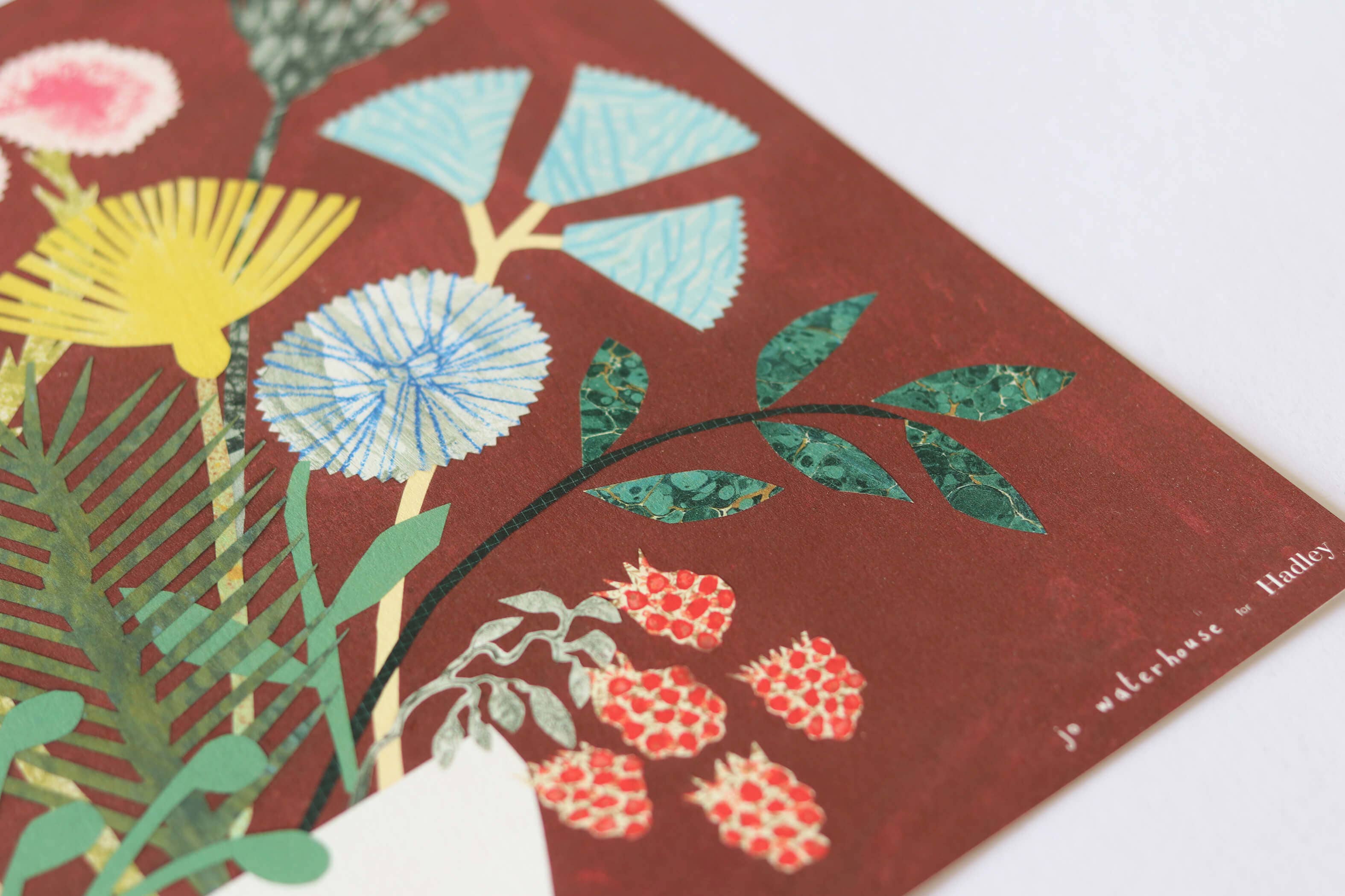 Floral design on a red background with visible branding.