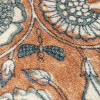 close up of insect and flower pattern on cushion