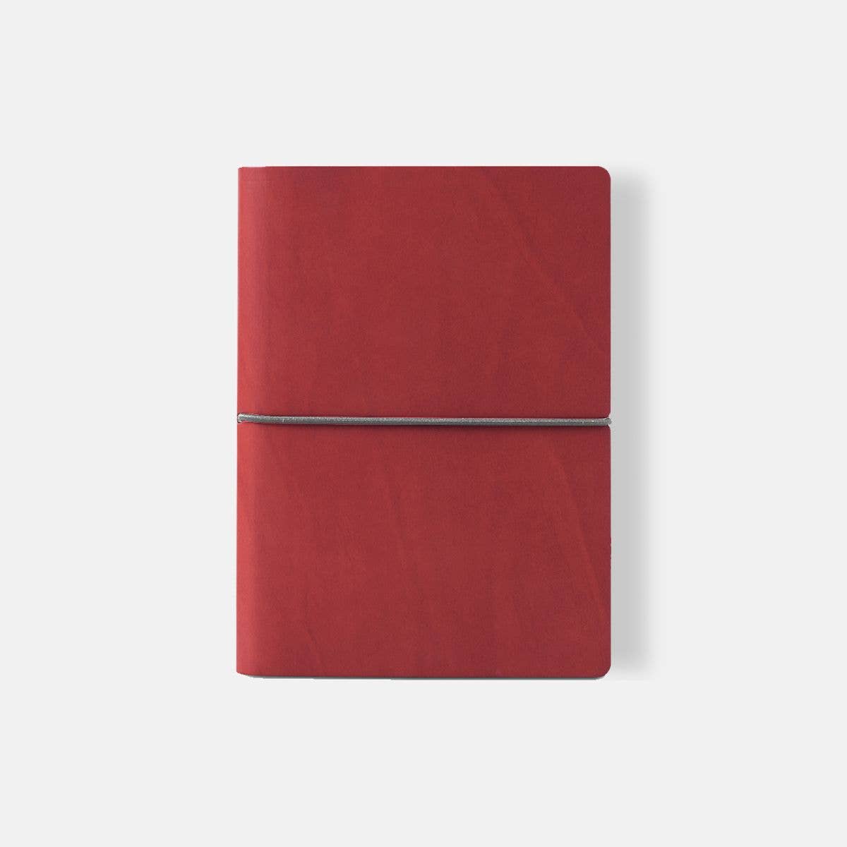 Red notebook with a silver strap on a white background