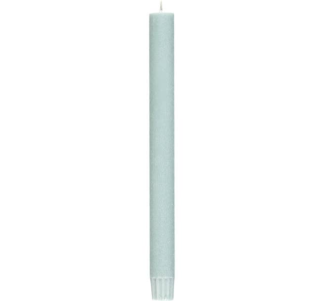 Light blue candle on a white background