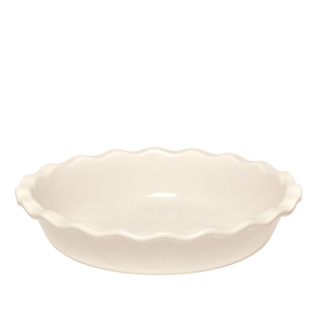 White ceramic pie dish with scalloped edge on a white background