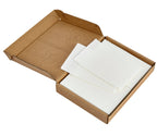 Open cardboard box with white sheets inside on a white background