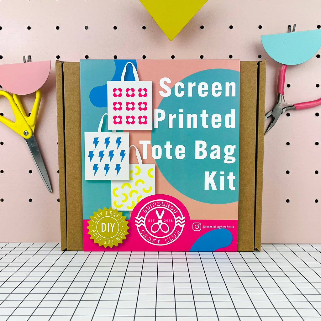 Screen Printed Tote Bag Kit packaging with tools on a grid background