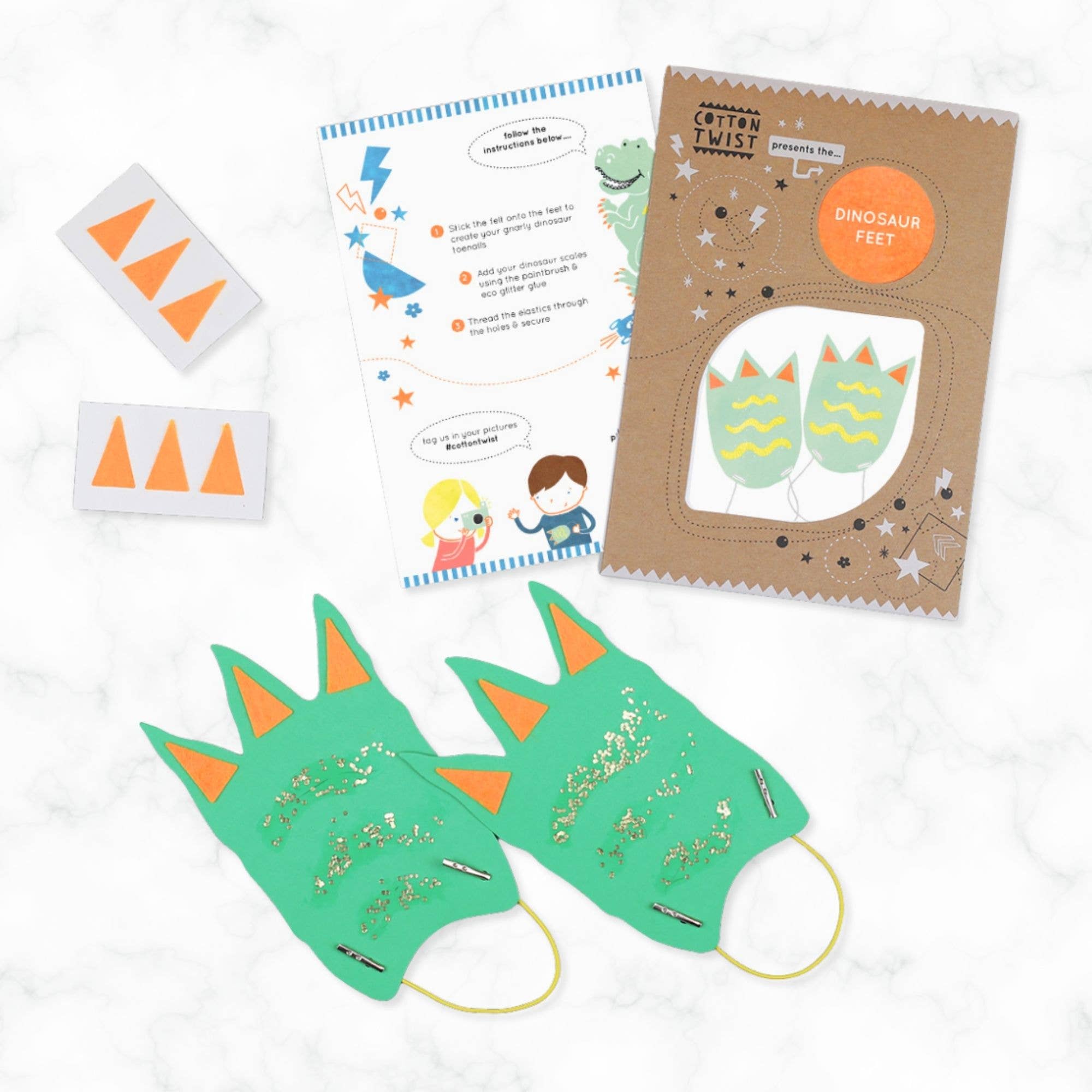 Dinosaur-themed craft kit with masks, templates, and instructions on a white background