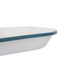 White dish with blue rim on a white background