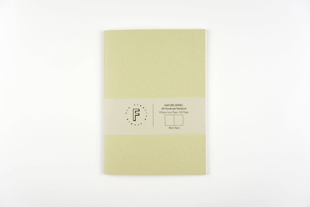 Light green notebook with a brand label on a white background