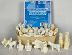 Assorted animal-shaped soaps with a box labeled 'Animal-Shaped Soaps' on a gray background.