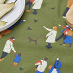 Fabric with a pattern of people and a dog on a green background