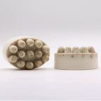 Two soap bars with a stone-like appearance and nodules on a white background