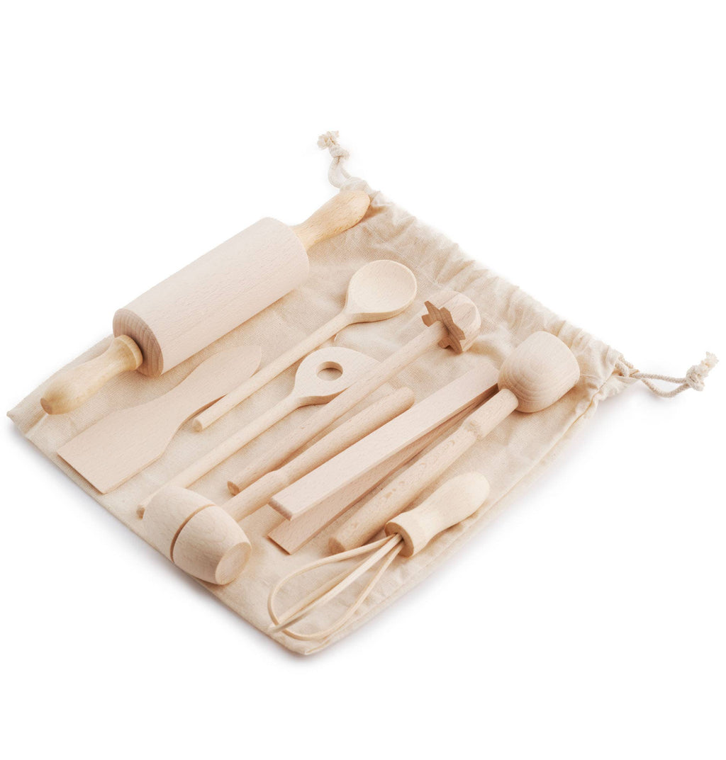 Set of wooden kitchen utensils in a drawstring bag on a white background