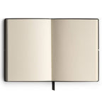 Open notebook with beige pages on a white background