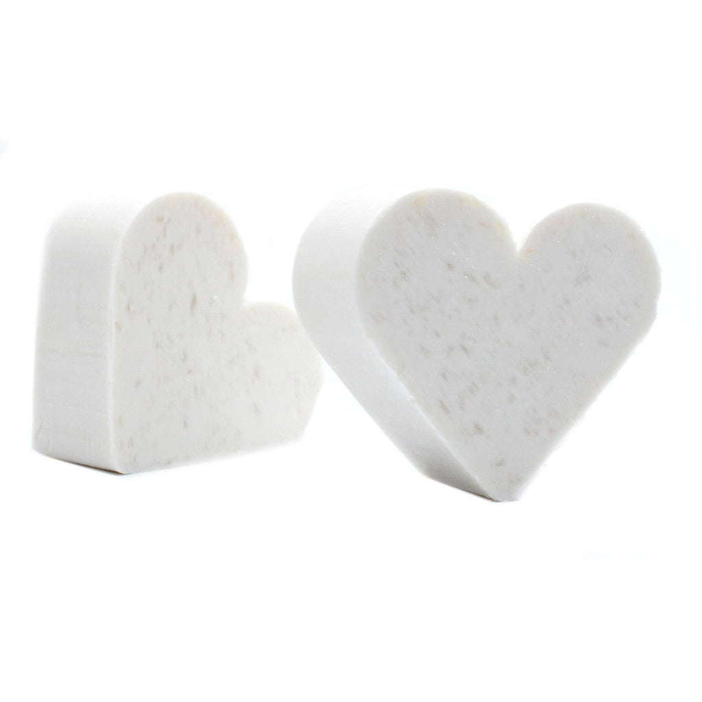Heart-shaped white marble objects on a white background