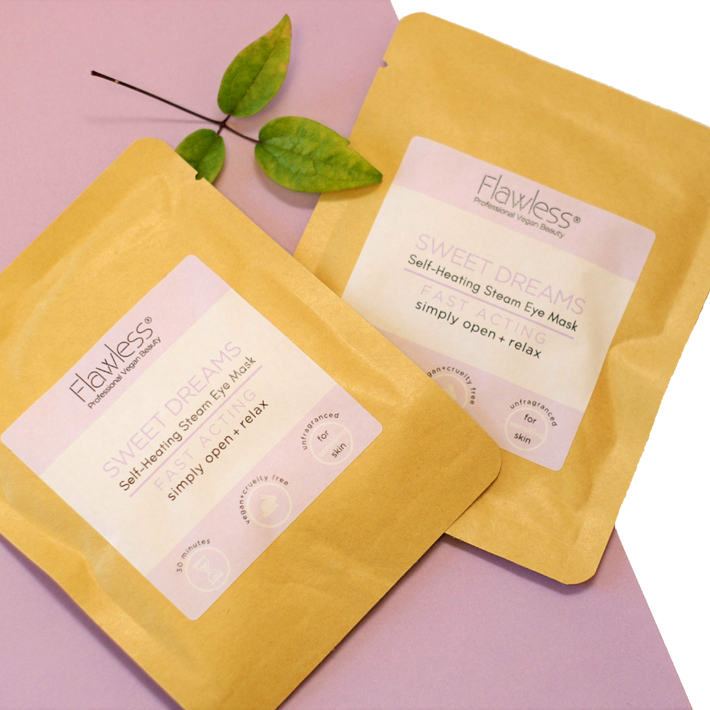 Two yellow eye mask packages labeled 'Flawless' on a pink background with green leaves.
