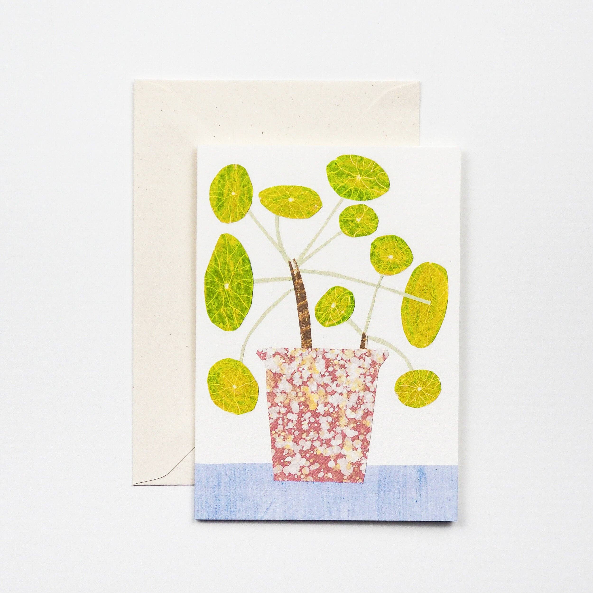 Card with a potted plant design featuring lime slices on a white background