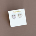 Heart-shaped earrings on a 'PepperYou' branded card against a brown background