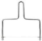 Metallic cheese slicer on a white background