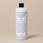 Bottle of Wool & Silk Wash on a beige background