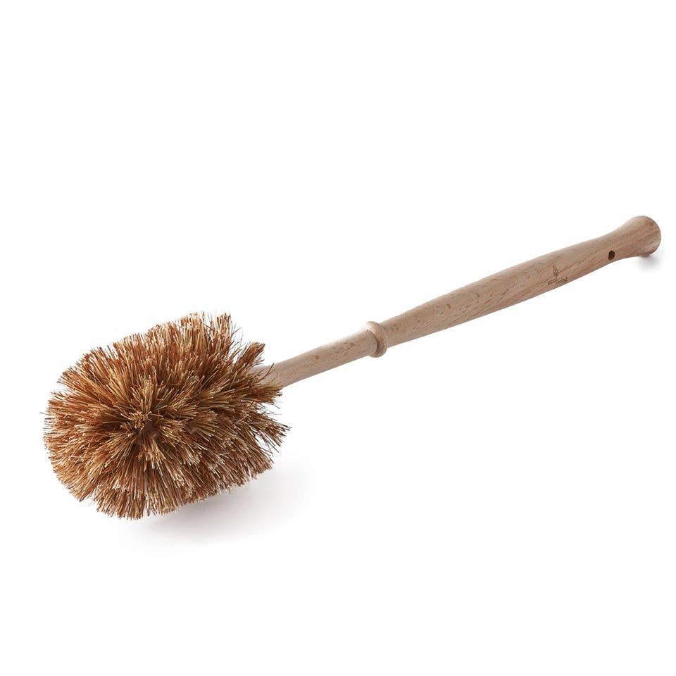 Bristle brush with wooden handle on a white background