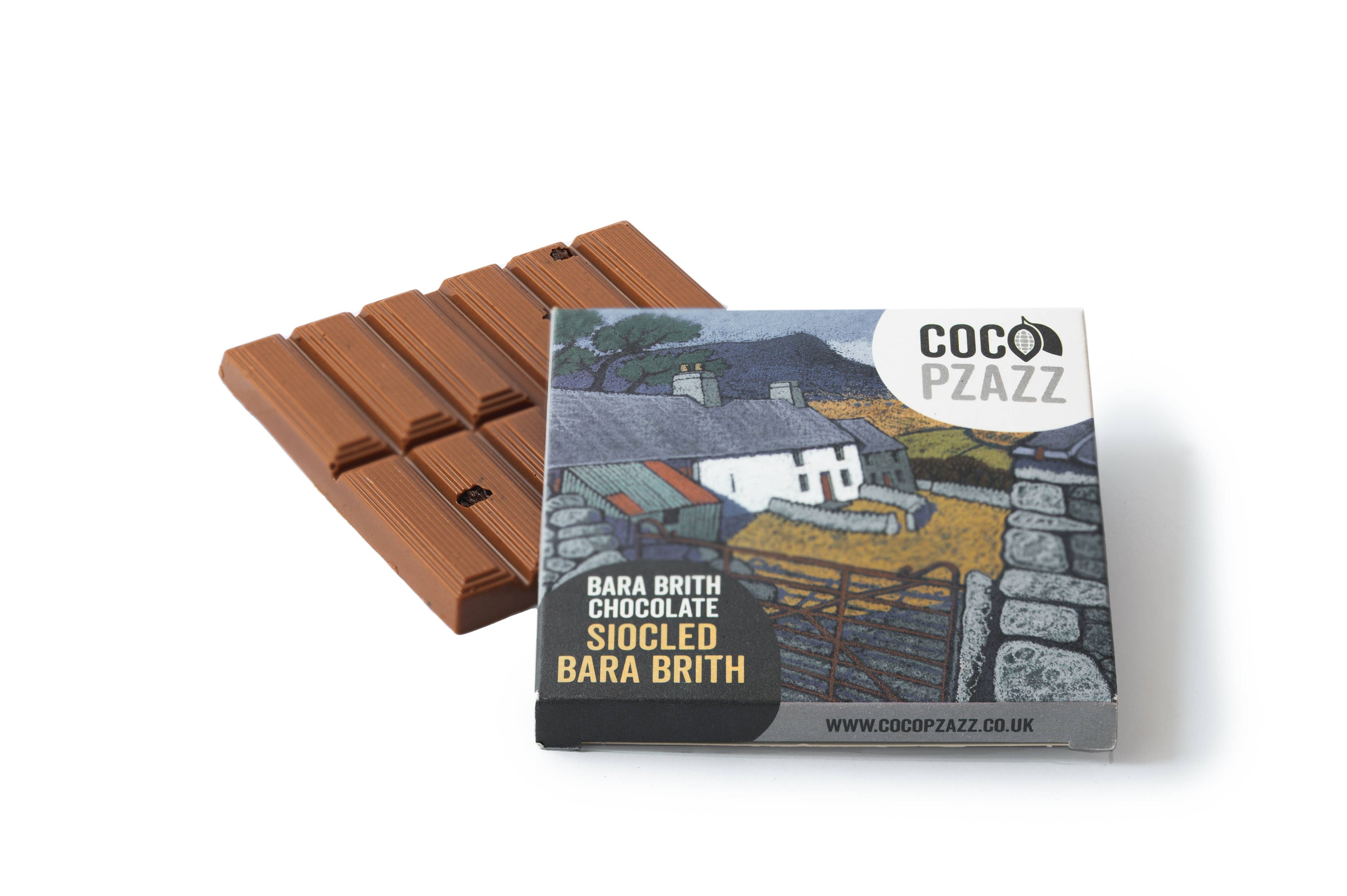 Chocolate bar with packaging featuring a scenic design and 'Coco Pzazz' branding.