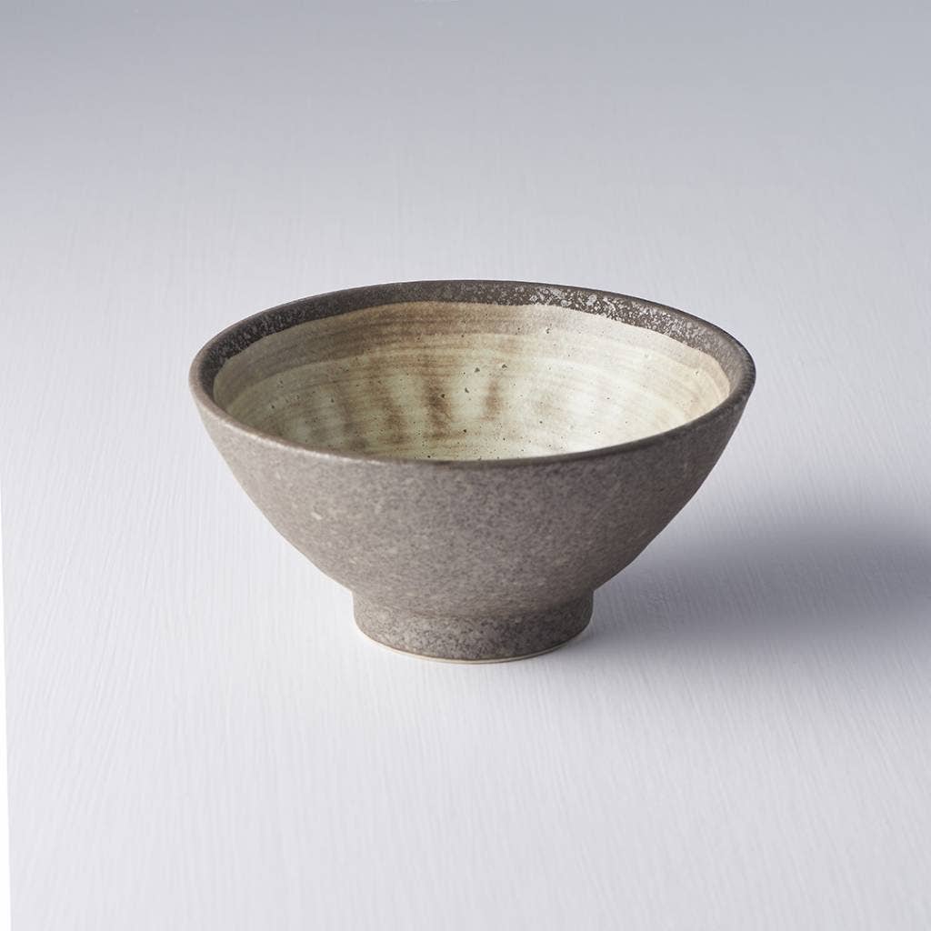 Ceramic bowl with textured surface on a light gray background