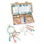 Craft kit with materials for making a dreamcatcher with a cardboard box on a white background