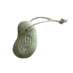 Green soap on a rope on a white background