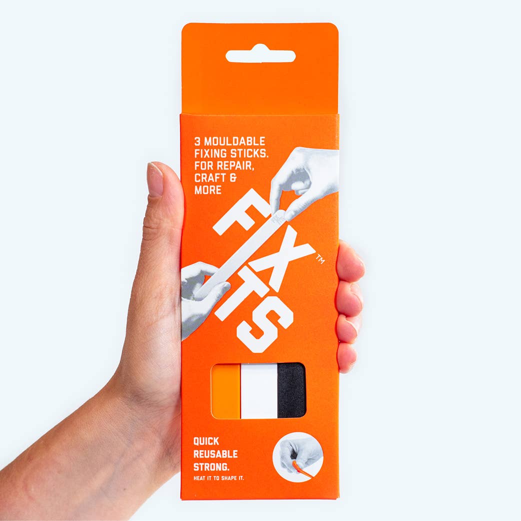 hand holding a pack of FixIts