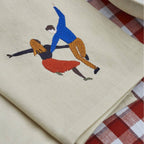 Napkin embroidered design of a couple dancing 