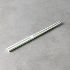 Light green chopsticks on a gray surface