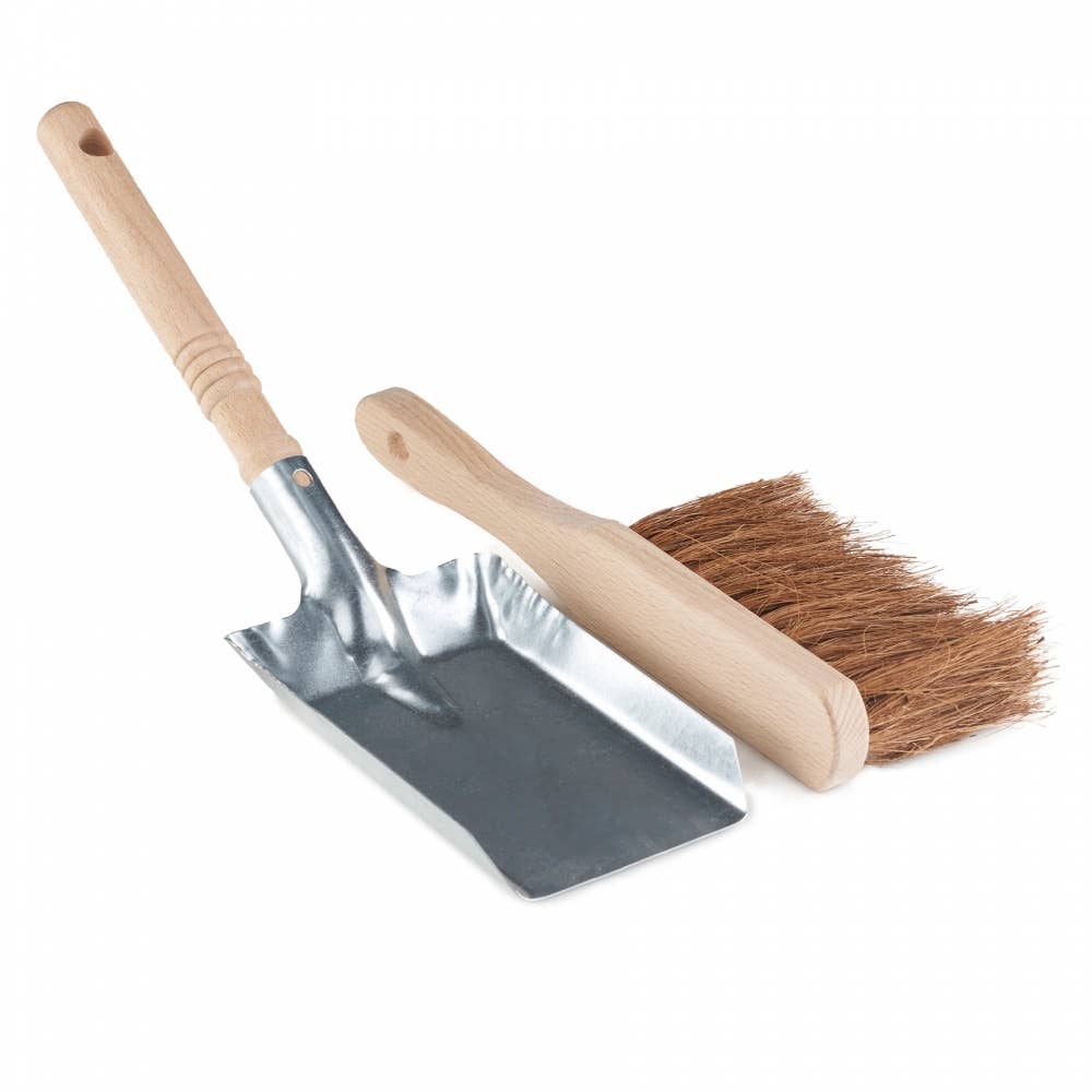 Metal dustpan and wooden brush with bristles on a white background