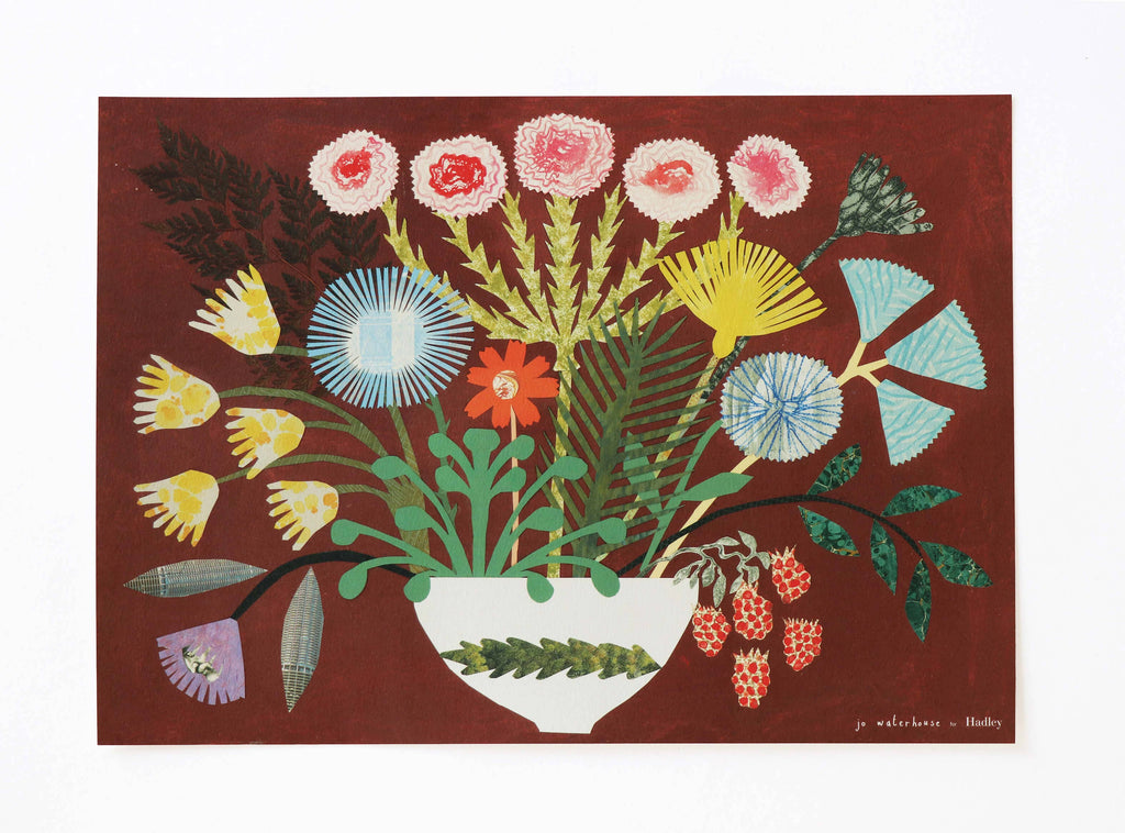 Colorful floral arrangement in a white vase on a red background