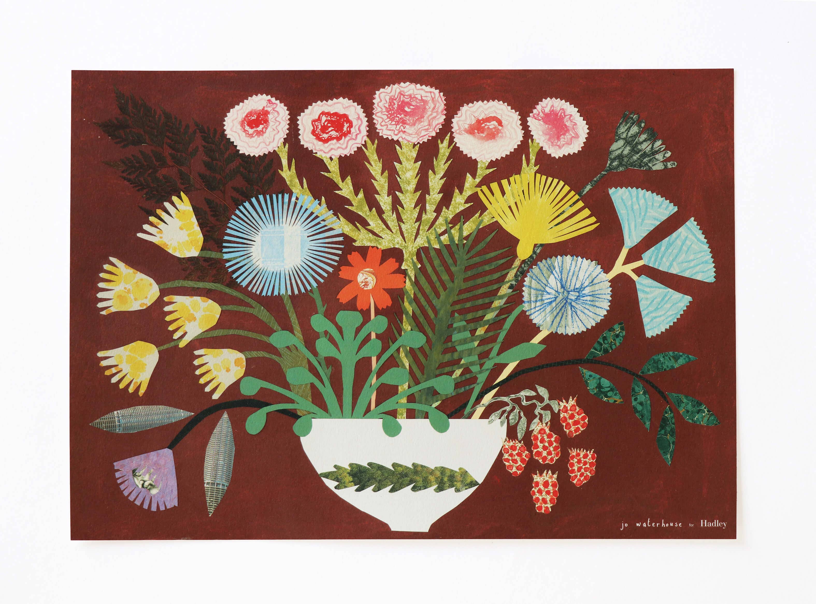 Colorful floral arrangement in a white vase on a red background