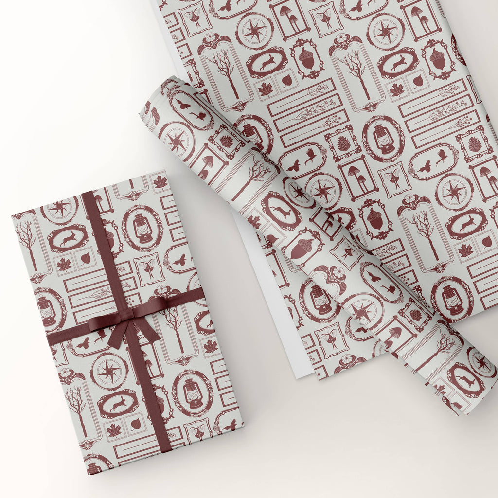 Gift box and wrapping paper with decorative patterns on a white background