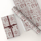 Gift box and wrapping paper with decorative patterns on a white background