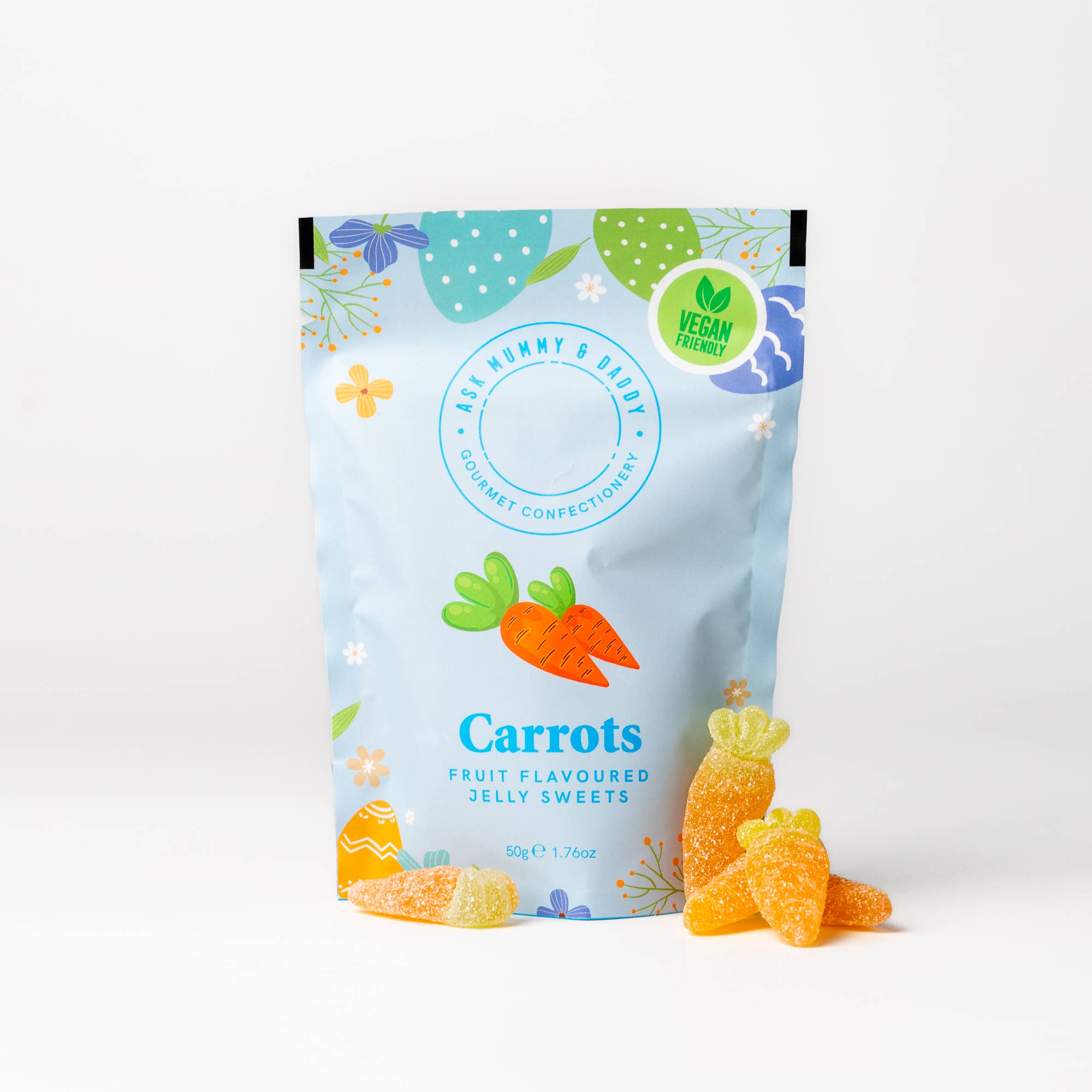 Blue pack of fruit-flavored jelly sweets shaped like carrots with a visible brand logo on a white background.