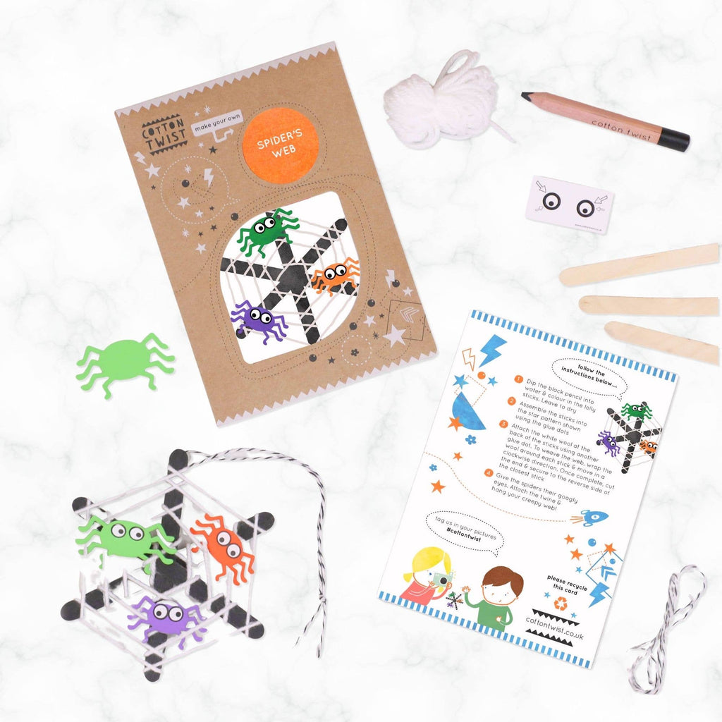 Spider web craft kit with materials and instructions on a white background