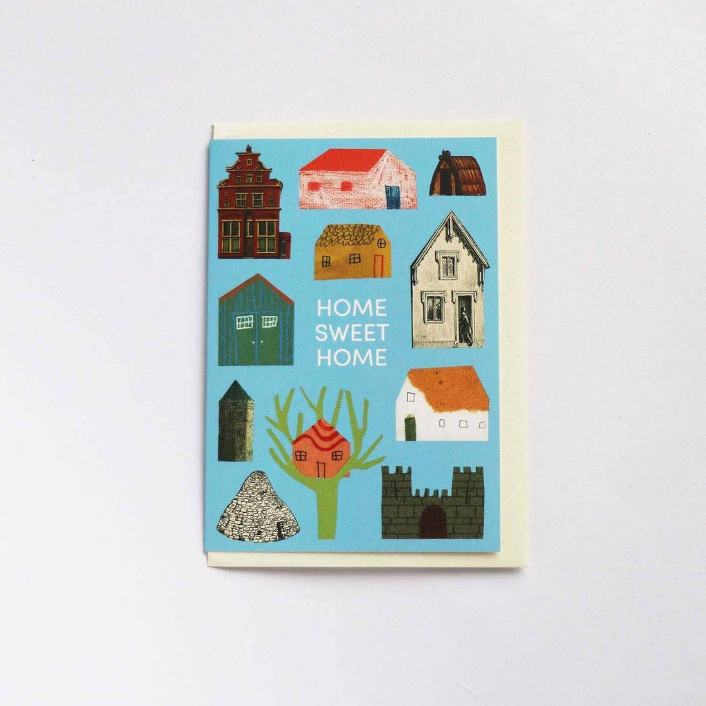 A whimsical light blue greetings card with cream envelope on a grey background - All Good Things