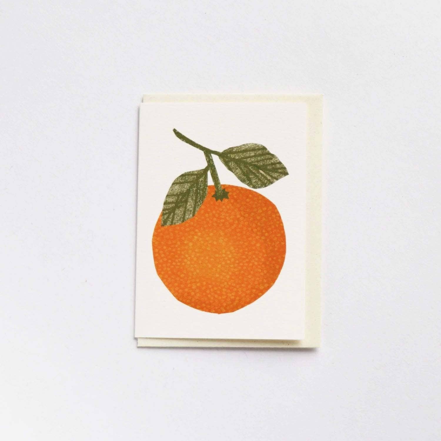 A mini greetings card featuring an orange with green leaves on a cream background - All Good Things