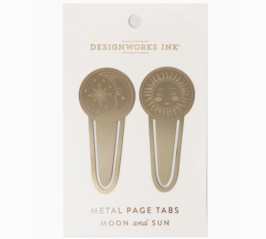 Metal page tabs with sun and moon designs on a Designworks Ink packaging.