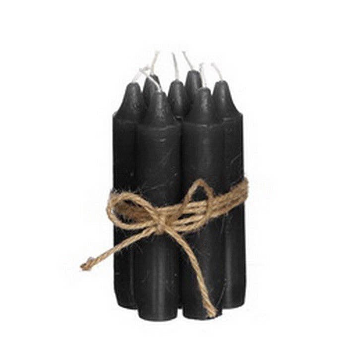 Group of black taper candles, tied with string, on a white background - All Good Things